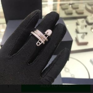 Apm triple stacked hoop safety pin crystal ring